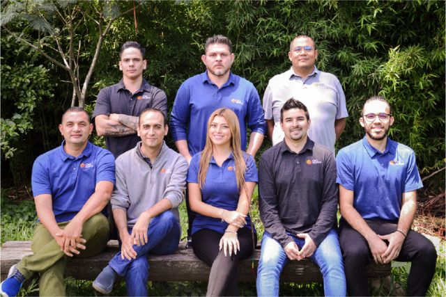 Group photo of CIO Solutions Costa Rica technical team posing outside